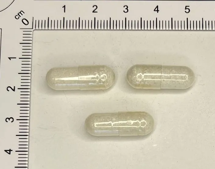 Close-up of a small, unlabeled bag of white powder, representing the dangerous research chemical MDPHP.